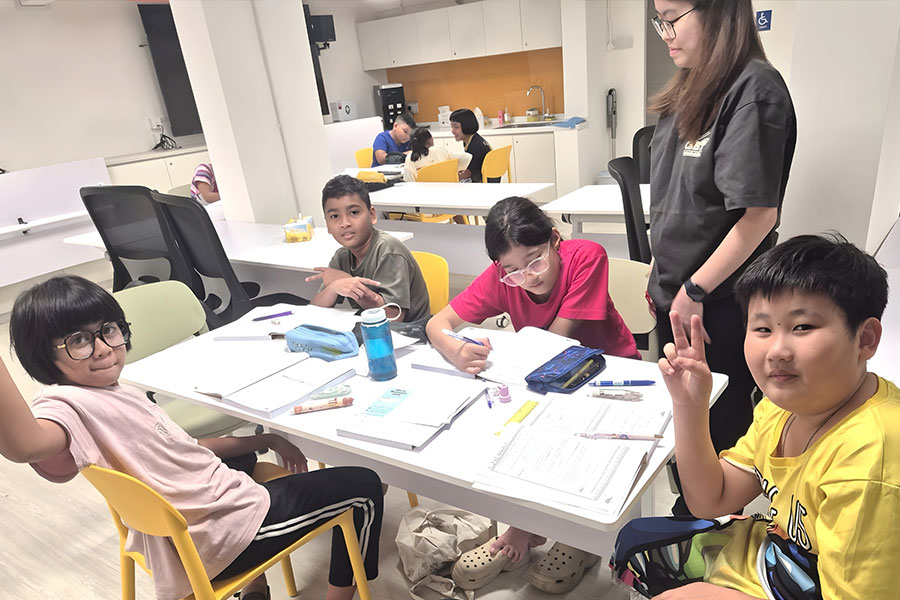 Children from ComLink+ @ Jurong West participating in a Mathematics educational support session.